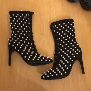 Never before worn heeled black booties with pearl